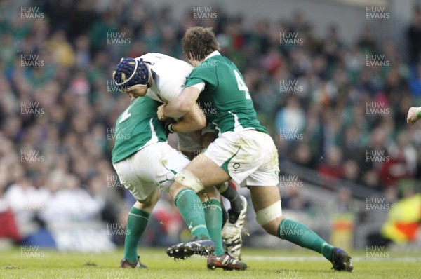 19.03.11 -  Ireland v England - RBS Six Nations 2011 - England's James Haskell tackled by Ireland's Rory Best and Donncha O'Callaghan. 