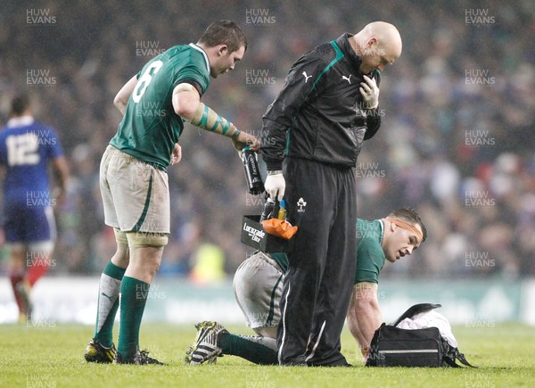 090313 Ireland v France - RBS Six Nations - Cian Healy of Ireland receives attention from team doctor Dr Eanna Falvey 