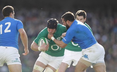 250212 Ireland v Italy - RBS Six Nations - Stephen Ferris of Ireland is tackled by Roberto Barbieri of Italy