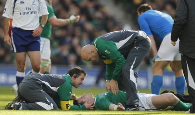 250212 Ireland v Italy - RBS Six Nations - Cian Healy of Ireland receives attention