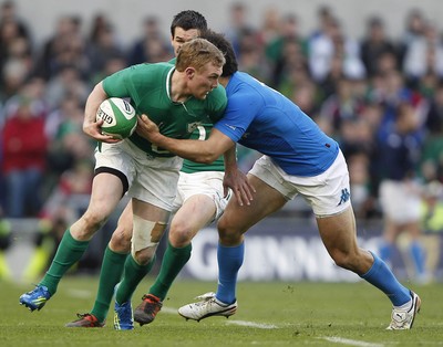 250212 Ireland v Italy - RBS Six Nations - Keith Earls of Ireland is tackled by Luke McLean of Italy