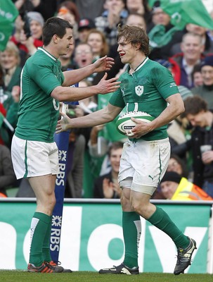 250212 Ireland v Italy - RBS Six Nations - Andrew Trimble of Ireland is congratulated by Jonathan Sexton on scoring the fifth Irish try