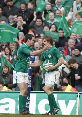 250212 Ireland v Italy - RBS Six Nations - Andrew Trimble of Ireland is congratulated by Jonathan Sexton on scoring the fifth Irish try