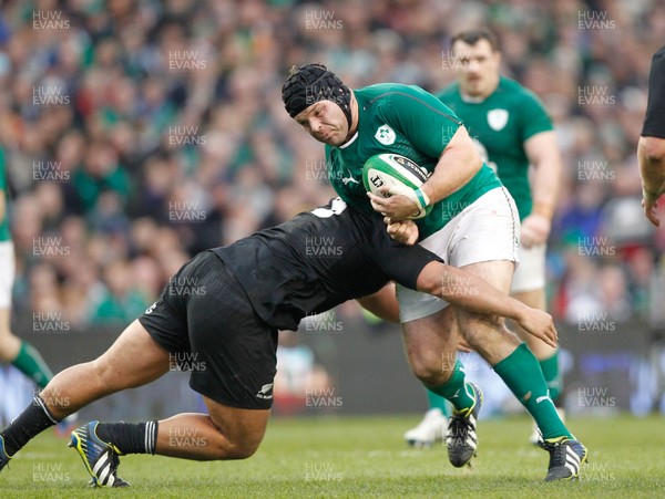 241113 - Guinness Series - Ireland v New Zealand  Mike Ross of Ireland tackled by  Charlie Faumuia of New Zealand(c) Huw Evans Agency