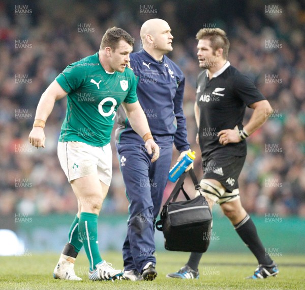 241113 - Guinness Series - Ireland v New Zealand  Cian Healy of Ireland is lead off the field by Dr Eanna Flavey(c) Huw Evans Agency