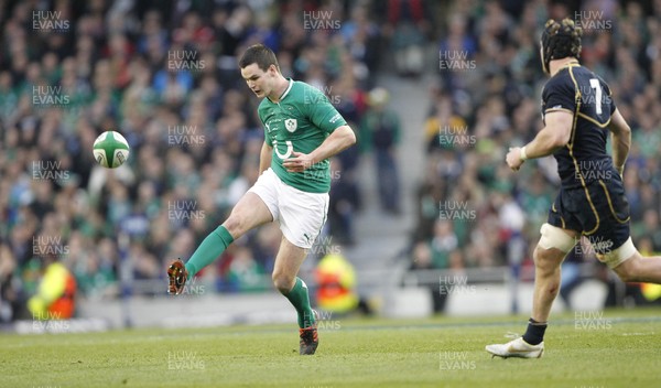 100312 - Ireland v Scotland - RBS 6 Nations -  Jonathan Sexton of Ireland kicks past Ross Rennie of Scotland