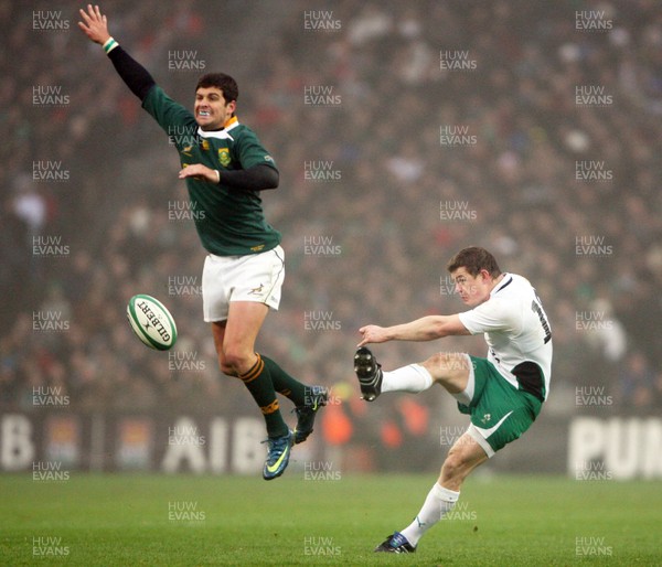 28.11.09  Ireland v South Africa... Brian O'Driscoll kicks as Morne Steyn tries to stop. 