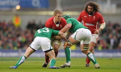 05.02.12 - Ireland v Wales - RBS Six Nations 2012 -.Bradley Davies of Wales is tackled by Fergus McFadden and Sean O'Brien of Ireland..