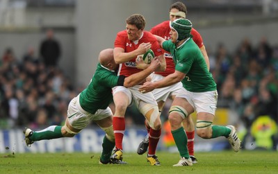 05.02.12 - Ireland v Wales - RBS Six Nations 2012 -.Rhys Priestland of Wales is tackled by Paul O'Connell and Sean O'Brien of Ireland..