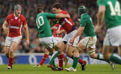 05.02.12 - Ireland v Wales - RBS Six Nations 2012 -.George North of Wales pushes off Jonathan Sexton of Ireland..