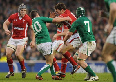 05.02.12 - Ireland v Wales - RBS Six Nations 2012 -.George North of Wales pushes off Jonathan Sexton of Ireland..