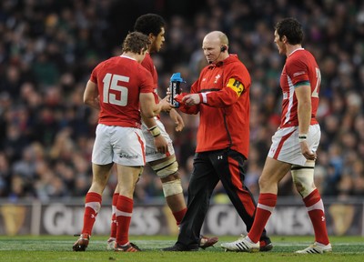 05.02.12 - Ireland v Wales - RBS Six Nations 2012 -.Neil Jenkins gives Leigh Halfpenny of Wales his kicking tee to kick the match winning penalty..