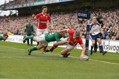 05.02.12  Ireland  v Wales .Wales' Jonathan Davies scores try despite tackle by Gordon D'Arcy of Ireland..