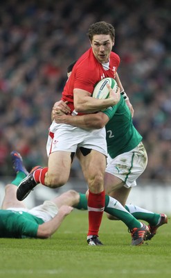 05.02.12  Ireland  v Wales .Wales' George North is tackled by Jonathan Sexton of Ireland..