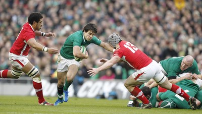 05.02.12 - Ireland v Wales - RBS Six Nations.Ireland's Conor Murray is tackled by Toby Faletau and Jonathan Davies of Wales.