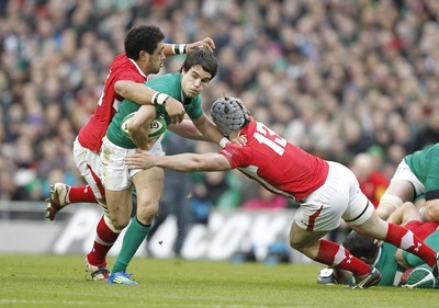 05.02.12 - Ireland v Wales - RBS Six Nations.Ireland's Conor Murray is tackled by Toby Faletau and Jonathan Davies of Wales.