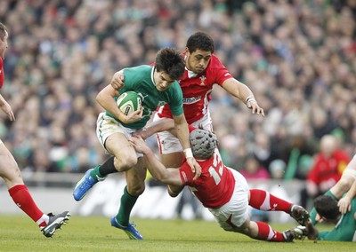 05.02.12 - Ireland v Wales - RBS Six Nations.Ireland's Conor Murray is tackled by Toby Faletau and Jonathan Davies of Wales.