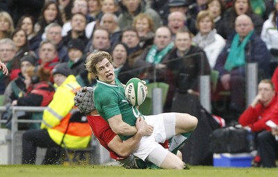 05.02.12 - Ireland v Wales - RBS Six Nations.Ireland's Andrew Trimble is tackled by Wales' Jonathan Davies.