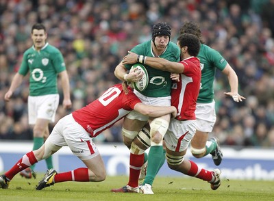 05.02.12 - Ireland v Wales - RBS Six Nations.Ireland's Stephen Ferris is tackled by Wales' Rhys Priestland and Toby Faletau.