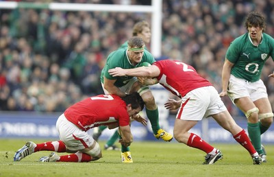 05.02.12 - Ireland v Wales - RBS Six Nations.Ireland's Jamie Heaslip is tackled by Wales' Sam Warburton and Huw Bennett.