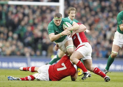 05.02.12 - Ireland v Wales - RBS Six Nations.Ireland's Jamie Heaslip is tackled by Wales' Sam Warburton and Huw Bennett.