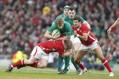 05.02.12 - Ireland v Wales - RBS Six Nations.Ireland's Andrew Trimble is tackled by Wales' Rhys Gill and Mike Phillips.