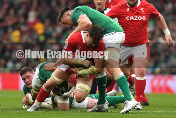 050222 - Ireland v Wales - Guinness Six Nations - Taine Basham of Wales is tackled by Jack Conan of Ireland