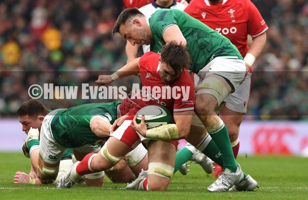 050222 - Ireland v Wales - Guinness Six Nations - Taine Basham of Wales is tackled by Jack Conan of Ireland