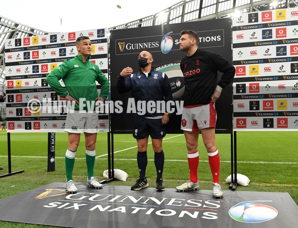 050222 - Ireland v Wales - Guinness Six Nations - Johnny Sexton of Ireland, Referee Jaco Peyper and Dan Biggar of Wales during the coin toss