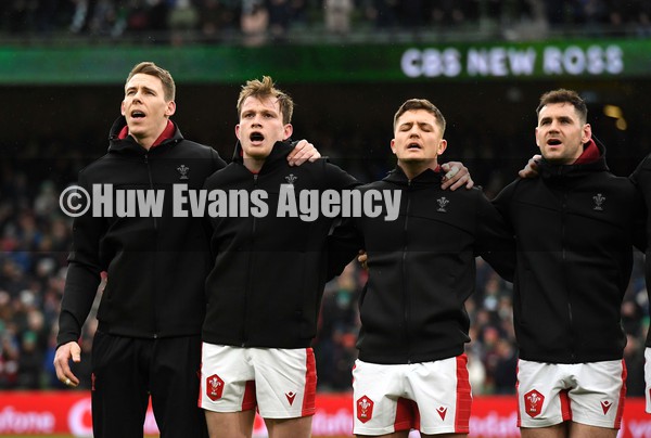 050222 - Ireland v Wales - Guinness Six Nations - Liam Williams, Nick Tompkins, Callum Sheedy and Tomos Williams of Wales during the anthems