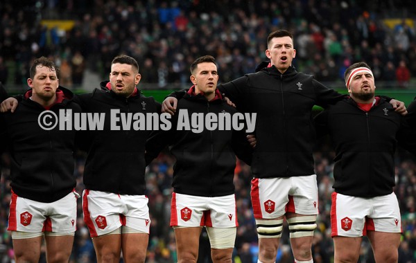 050222 - Ireland v Wales - Guinness Six Nations - Ryan Elias, Gareth Thomas, Owen Watkin, Adam Beard and Wyn Jones of Wales during the anthems