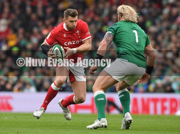050222 - Ireland v Wales - Guinness Six Nations - Dan Biggar of Wales takes on Andrew Porter of Ireland
