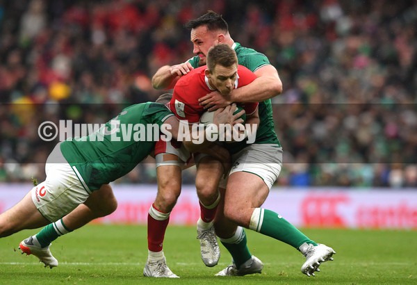 050222 - Ireland v Wales - Guinness Six Nations - Liam Williams of Wales is tackled by Hugo Keenan and Ronan Kelleher of Ireland