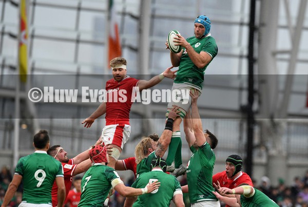 050222 - Ireland v Wales - Guinness Six Nations - Tadhg Beirne of Ireland beats Aaron Wainwright of Wales to line out ball