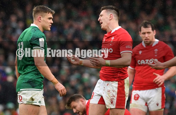 050222 - Ireland v Wales - Guinness Six Nations - Josh Adams of Wales reacts after colliding with Johnny Sexton of Ireland