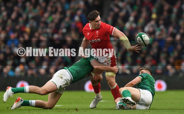 050222 - Ireland v Wales - Guinness Six Nations - Taine Basham of Wales is tackled by Garry Ringrose of Ireland