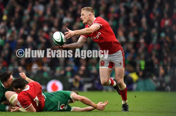 050222 - Ireland v Wales - Guinness Six Nations - Johnny McNicholl of Wales gets the ball away