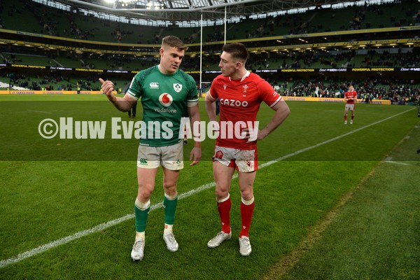 050222 - Ireland v Wales - Guinness Six Nations - Garry Ringrose of Ireland and Josh Adams of Wales at the end of the game