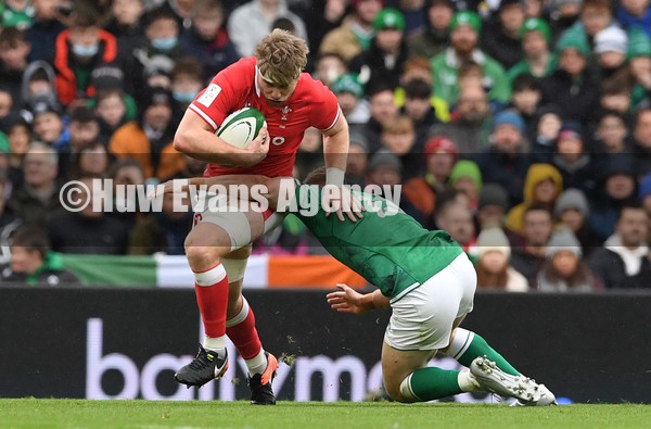 050222 - Ireland v Wales - Guinness Six Nations - Aaron Wainwright of Wales is tackled by Garry Ringrose of Ireland