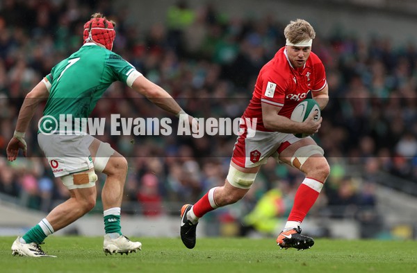 050222 - Ireland v Wales - Guinness Six Nations Championship - Aaron Wainwright of Wales is challenged by Josh van der Flier of Ireland