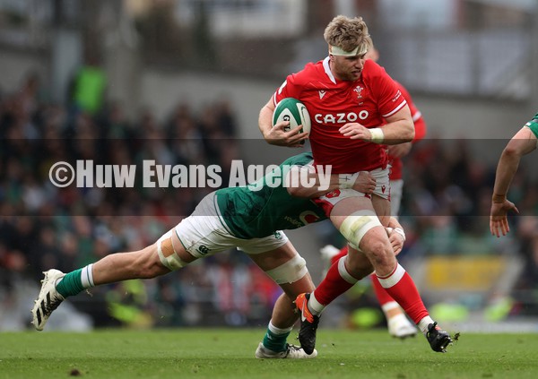 050222 - Ireland v Wales - Guinness Six Nations Championship - Aaron Wainwright of Wales is tackled by Josh van der Flier of Ireland