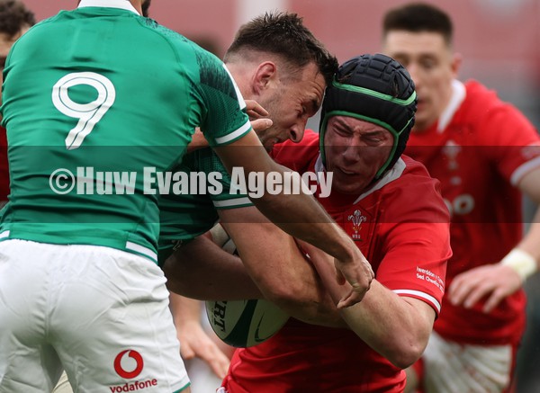 050222 - Ireland v Wales - Guinness Six Nations Championship - Adam Beard of Wales is tackled by Jack Conan of Ireland