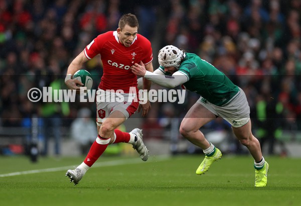050222 - Ireland v Wales - Guinness Six Nations Championship - Liam Williams of Wales is tackled by Mack Hansen of Ireland