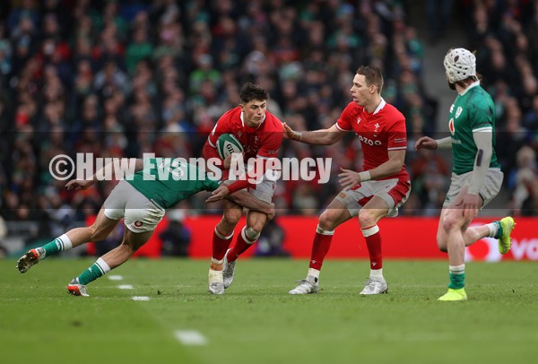 050222 - Ireland v Wales - Guinness Six Nations Championship - Louis Rees-Zammit of Wales is tackled by Hugo Keenan of Ireland