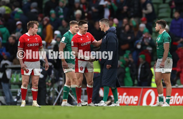 050222 - Ireland v Wales - Guinness Six Nations Championship - Josh Adams of Wales and Johnny Sexton of Ireland shake hands at full time