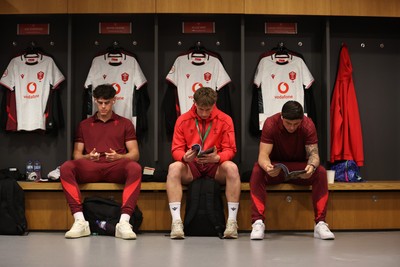 060326 - Ireland v Wales - Guinness Six Nations Championship - Eddie James, Ellis Mee and Louis Rees-Zammit of Wales in the changing rooms