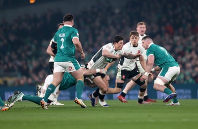 060326 - Ireland v Wales - Guinness Six Nations Championship - Louis Rees-Zammit of Wales is tackled by Jack Conan of Ireland 