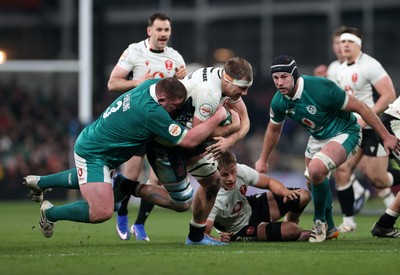 060326 - Ireland v Wales - Guinness Six Nations Championship - Ben Carter of Wales is tackled by Tadhg Furlong of Ireland 