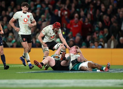 060326 - Ireland v Wales - Guinness Six Nations Championship - Rhys Carre of Wales celebrates scoring a try with team mates