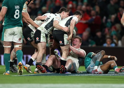 060326 - Ireland v Wales - Guinness Six Nations Championship - Rhys Carre of Wales celebrates scoring a try with team mates